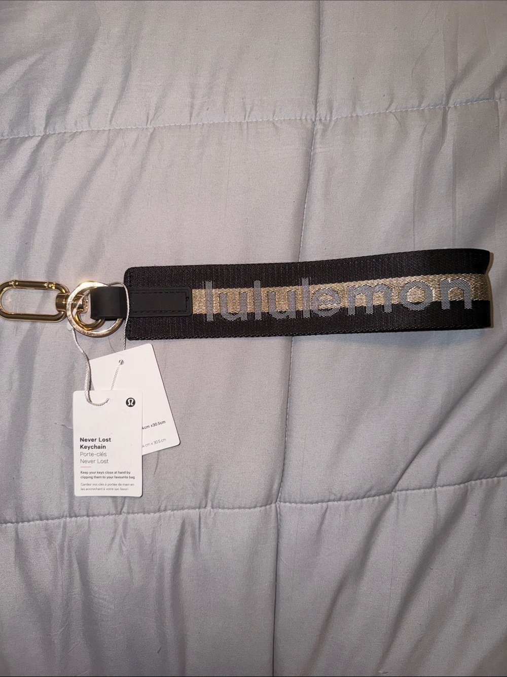 lululemon athletica Black and Gold Never Lost Keychain Wristlet